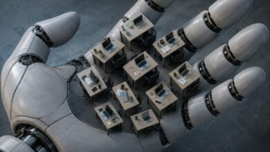 Robotic Hand Holds Miniature Offices, Symbolizing Automation's Workplace Impact /automation , artificial intelligence , robotics , future of work , workplace technology