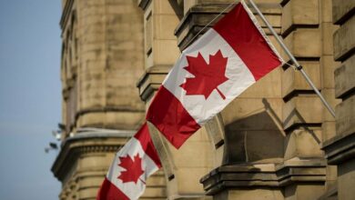 Canadian Flags Fly on Government Building /Canada , flag , government , building , maple leaf