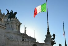 Italy's National Flag Flies Proudly Over Historic Monument /Italy , national flag , monument , historical landmark , Italian pride