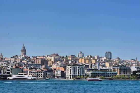 Istanbul's Skyline Showcases Vibrant Urban Landscape and Maritime Activity /Istanbul , skyline , Galata Tower , Bosphorus , maritime activity